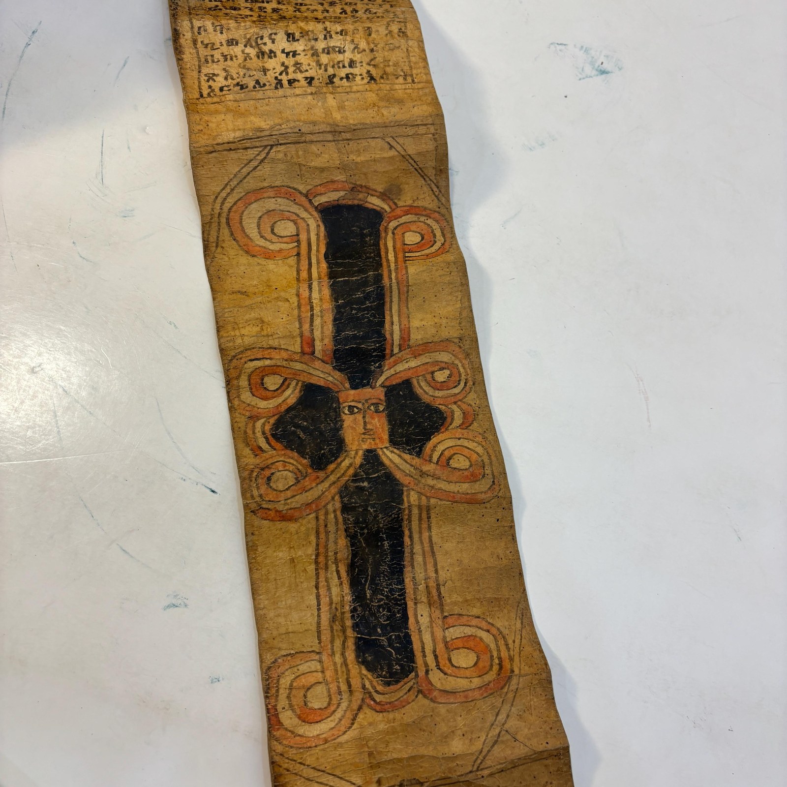Ethiopian Manuscript Healing Scroll 4" x 82" with 3 images and 191 lines of text in three sheets of hide, connected with leather stitches — photograph 5.