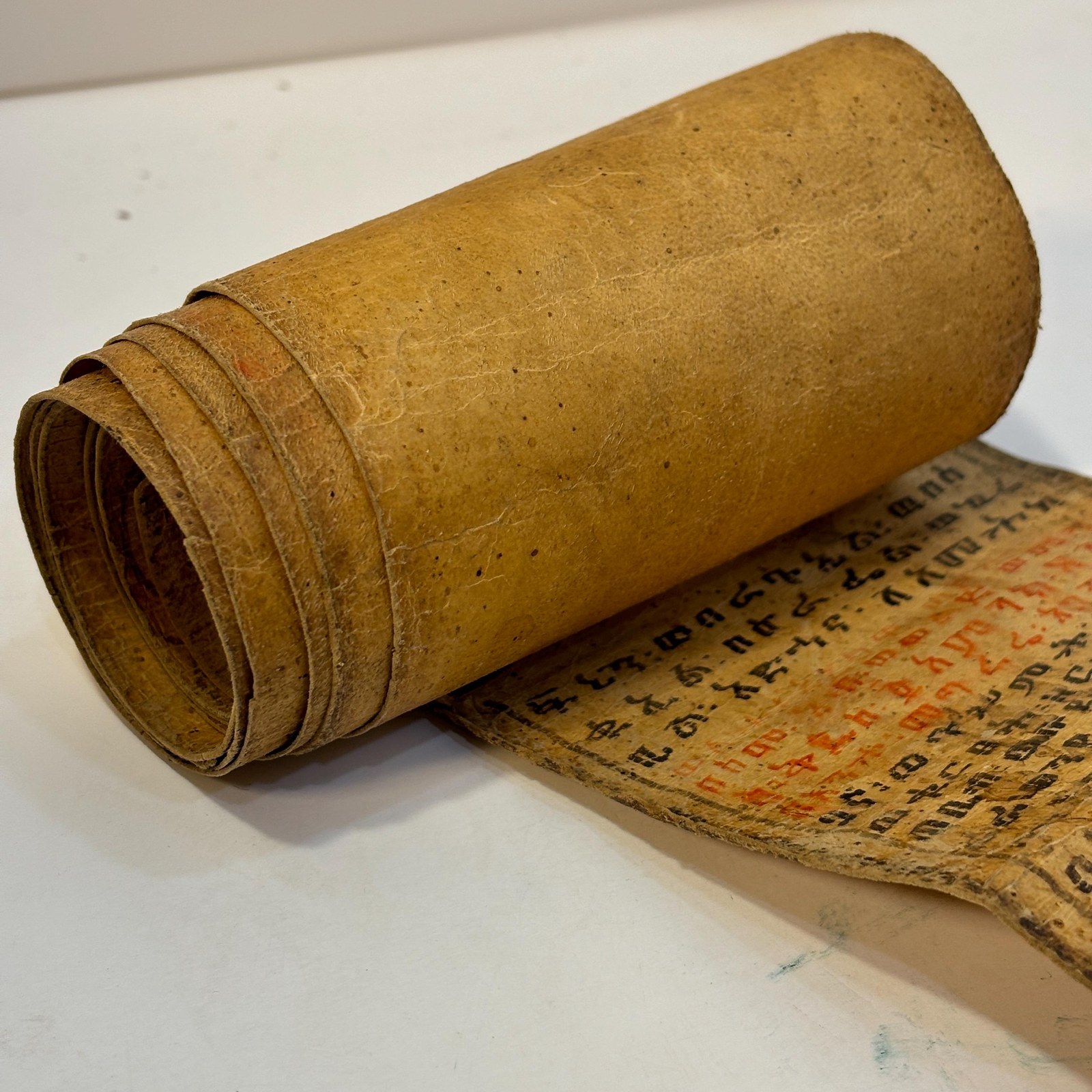 Ethiopian Manuscript Healing Scroll 4" x 82" with 3 images and 191 lines of text in three sheets of hide, connected with leather stitches — photograph 9.