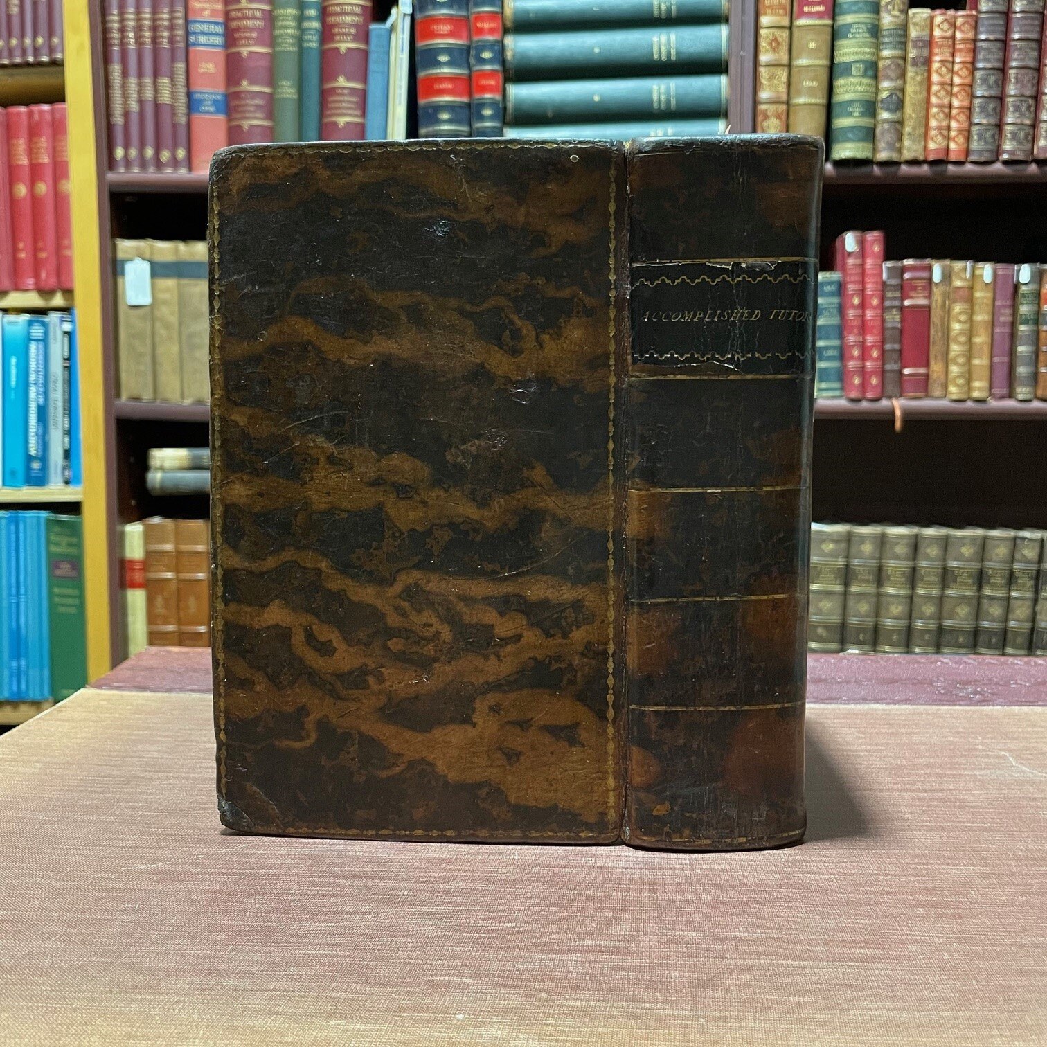 The Accomplished Tutor; or, A Complete System of Liberal Education: Containing the Most Improved Theory and Practice of The Following Subjects: 1. English Grammar and Elocution 2. Penmanship and Shorthand 3. Arithmetic, Vulgar and Decimal 4. Stock-Holding and Merchant Accounts 5. Mensuration and Architecture 6. Optics 7. Algebra 8. Doctrine of Annuities 9. Trigonometry 10.Logarithms 11. Geography 12. Astronomy 13. Mechanics 14. Electricity 15. Pneumatics 16. Hydrostatics 17. Hydraulics 18. Drawing, Engraving, and Painting. and Other Useful Matter. Embellished with Twenty Copper-plates and Six Maps, neatly engraved. Second Edition. In Two Volumes. Two volumes bound as one. — photograph 3.