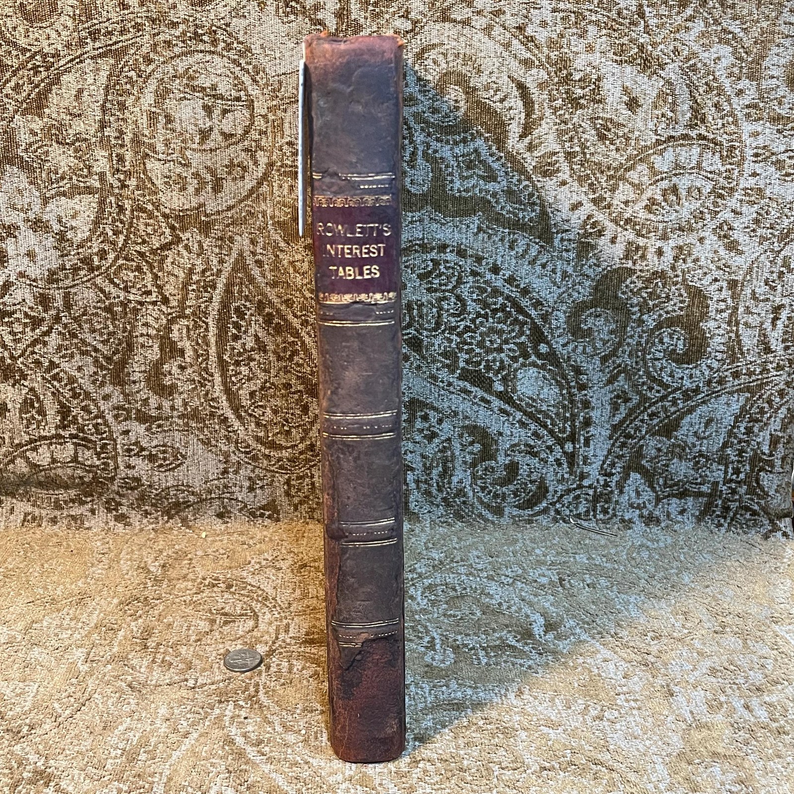Stereotype Edition of Rowlett's Tables of Discount, or Interest; Showing at Sight, The Interest on Each and Every Dollar, From Unit, or One, to Two Thousand: on Every Ten Dollars, from Two Thousand to Three Thousand; on Every Fifty, from Three Thousand to Five Thousand; On Rvery Five Hunder, from Five Thousand to Ten Thousand; for Each and Every Day. from One, to Sixty-four Days Inclusive; Also, For Every Month, from One to Twelve, and for Eighteen Months, and Two Years; besides A Complete Cent Table: The Whole Computed at Six Per Cent. According to the Equitable Principles of The Banks; and as Practised between Individuals, Throughout the United Staes, in Conformity to Statute Law; Together with Directions at The End of The Introduction, for Finding, almost at Sight, (by aid of the tables,) The Exact Bank Interest for any Number of Days, from Sixty-four to one Hundred and Twenty-Four Days, &c. Likewise Examples contained in the introduction, showing in what manner (by means of the tables) to Ascertain the Interest at Five, Seven, and At Eight Per Cent. And a Note under The First Page of The Figure Work, Explaining the Usual Mode of Computing Interest on Cents, and Fractions, Etc., Etc. — photograph 2.