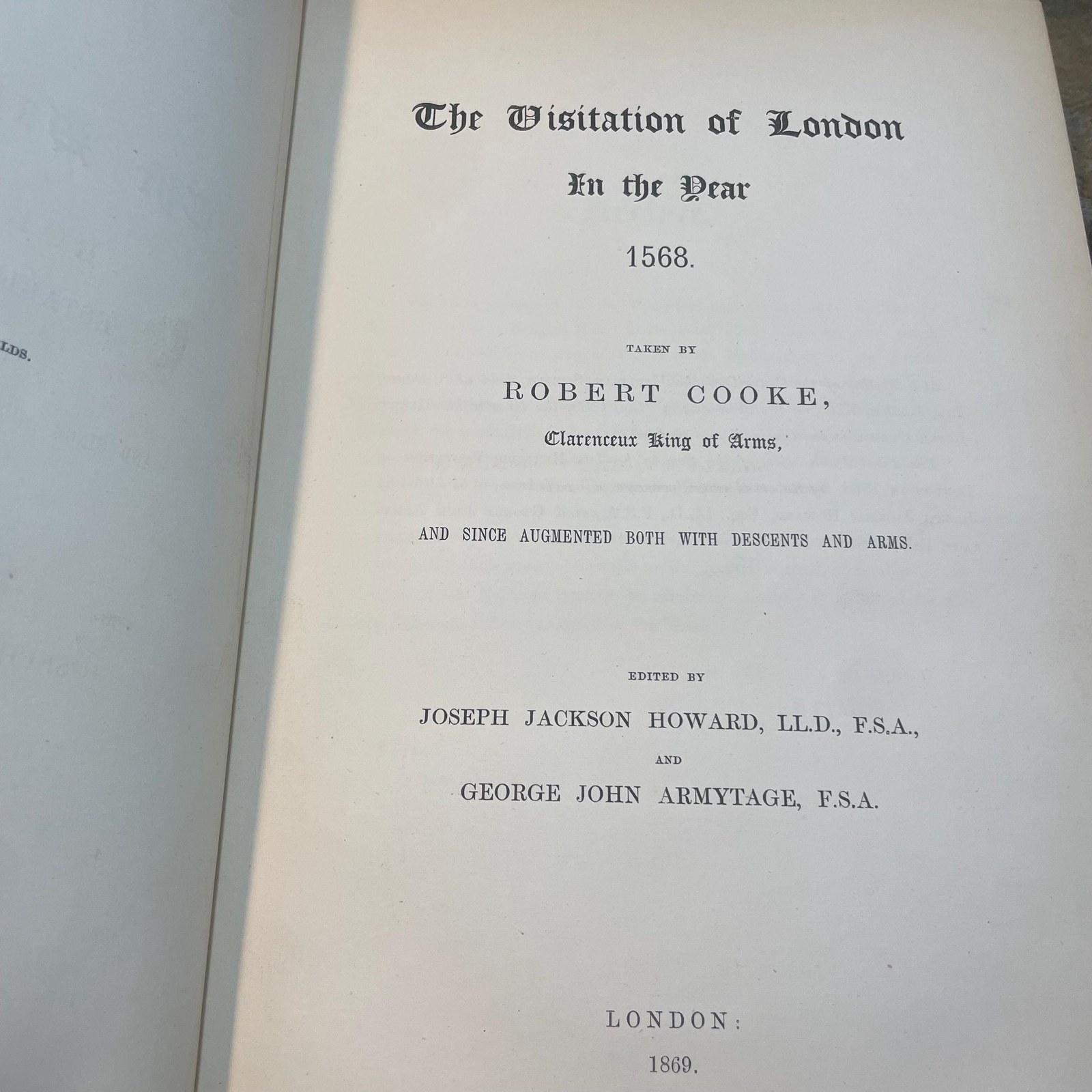 The Publications of The Harleian Society. Established A.D. 1869. Nine volumes comprising Vol.I.:The Visitation of London in the Year 1568. Taken by Robert Cooke…And Since Augmented Both With Descents and Arms. (London, 1869); Vol.II.: The Visitation of The Conty of Leicester In The Year 1619. Taken by William Camden.., Edited by John Fetherston. (London, 1870); Vol.III.:The Visitation of the County of Rutland In the Year 1618-19. Taken by William Camden... And Other Descents of Families Not in the Visitation. (London, 1870); Vol. IV.: The Visitations of The County of Nottingham In The Years 1569 and 1614, With Many other Descents of the Same County. Edited by George William Marshall, LL.M. (London, 1871); Vol. V.: The Visitations of The County of Oxford Taken in The Years 1566 by William Harvey, Clarencieux; 1574 by Richard Lee, Portcullis,.. and in 1634 by John Philpot, Somerset, and William Ryley, Bluemantle... Together with The Gatherings of Oxfordshire, Collected by Richard Lee in 1574. Edited and Annotated by William Henry Turner. (London, 1871); Vol. VI.: The Visitation of The County of Devon In The Year 1620. Edited by Frederic Thomas Colby (London, 1872); Vol.VII.: The Visitation of The County of Cumberland In The Year 1615. Taken by Richard St, George... Edited by John Fetherstone, F.S.A.(London, 1872); Vol. VIII.: Le Neve's Pedigrees of The Knights made By King Charles II., King James II., King William III. and Queen Mary, King William Alone, and Queen Anne. Edited by George w. Marshall, LL.D...(LOndon, 1873); Vol. IX.: The Visitation of the County of Cornwall, In The Year 1620. Edited by Lieut.-Colonel J.L. Vivian and Henry H. Drake, M.A., Ph.D....(London, 1874). Nine volumes total. — photograph 3.