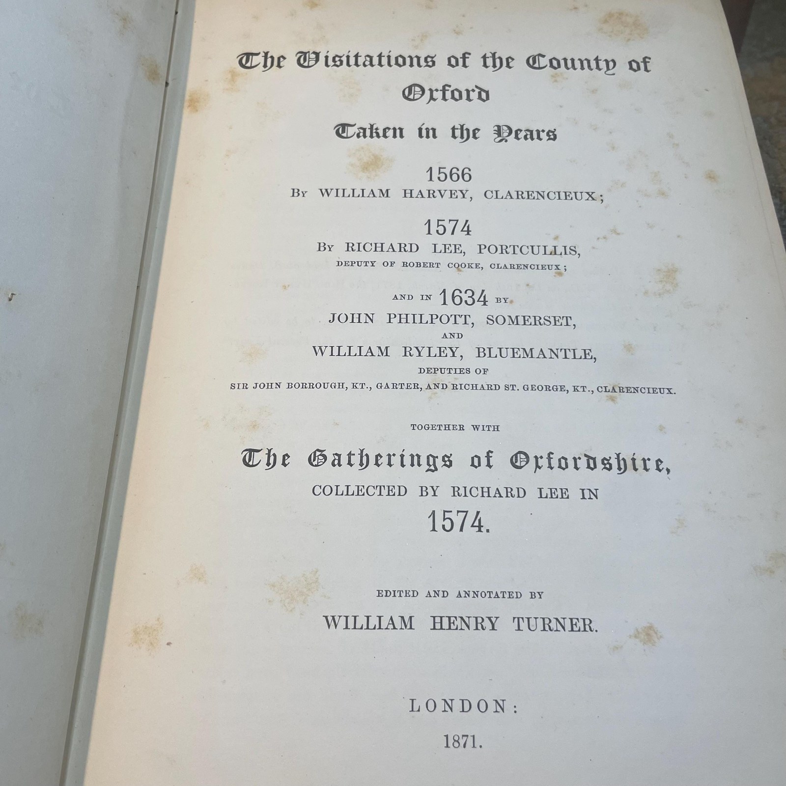 The Publications of The Harleian Society. Established A.D. 1869. Nine volumes comprising Vol.I.:The Visitation of London in the Year 1568. Taken by Robert Cooke…And Since Augmented Both With Descents and Arms. (London, 1869); Vol.II.: The Visitation of The Conty of Leicester In The Year 1619. Taken by William Camden.., Edited by John Fetherston. (London, 1870); Vol.III.:The Visitation of the County of Rutland In the Year 1618-19. Taken by William Camden... And Other Descents of Families Not in the Visitation. (London, 1870); Vol. IV.: The Visitations of The County of Nottingham In The Years 1569 and 1614, With Many other Descents of the Same County. Edited by George William Marshall, LL.M. (London, 1871); Vol. V.: The Visitations of The County of Oxford Taken in The Years 1566 by William Harvey, Clarencieux; 1574 by Richard Lee, Portcullis,.. and in 1634 by John Philpot, Somerset, and William Ryley, Bluemantle... Together with The Gatherings of Oxfordshire, Collected by Richard Lee in 1574. Edited and Annotated by William Henry Turner. (London, 1871); Vol. VI.: The Visitation of The County of Devon In The Year 1620. Edited by Frederic Thomas Colby (London, 1872); Vol.VII.: The Visitation of The County of Cumberland In The Year 1615. Taken by Richard St, George... Edited by John Fetherstone, F.S.A.(London, 1872); Vol. VIII.: Le Neve's Pedigrees of The Knights made By King Charles II., King James II., King William III. and Queen Mary, King William Alone, and Queen Anne. Edited by George w. Marshall, LL.D...(LOndon, 1873); Vol. IX.: The Visitation of the County of Cornwall, In The Year 1620. Edited by Lieut.-Colonel J.L. Vivian and Henry H. Drake, M.A., Ph.D....(London, 1874). Nine volumes total. — photograph 5.