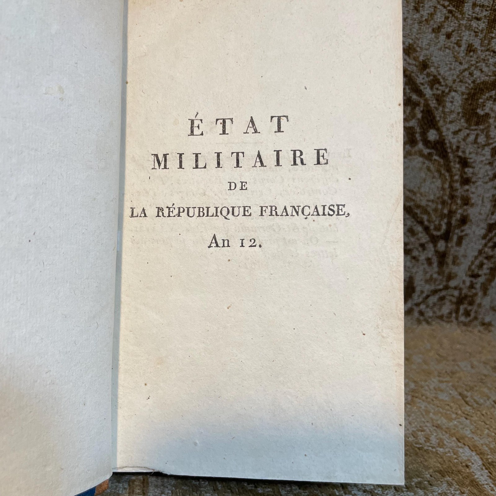 État Militaire de la République Française, pour l'an douze, dédié au Premier Consul, d’après son autorisation; par L’adjudant-Commandant Champeaux, employé à l’état-major général de la sixième division. Translated: Military state of the french republic, for year twelve, dedicated to the first consul, with his authorization; by Adjutant-Commandant Champeaux, employed at the general staff of the sixth division. — photograph 4.