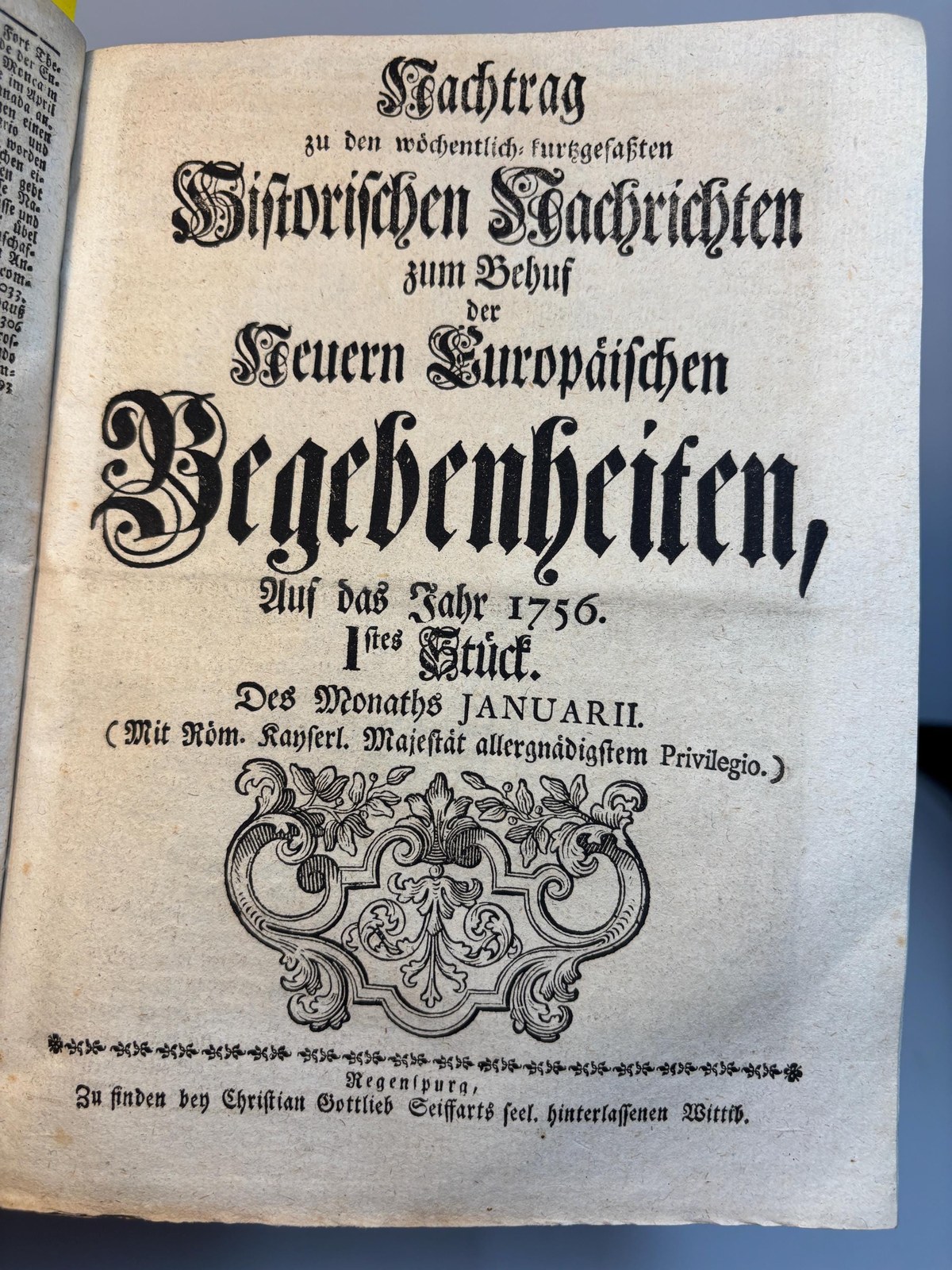 Zu den wöchentlich kurzgefaßten Historischen Nachrichten zum Behuf der Neueren Europäischen Begebenheiten, Auf das Jahr 1756. 1stes Stück. Des Monats Januarii. (Mit Röm. Kayserl. Majestät allergnädigstem Privilegio.) ---AND--- Nachtrag. Translated: Of the weekly summarized Historical Reports for the purpose of Recent European Events, For the year 1756. 1st issue. Of the month of January. (With the most gracious privilege of His Roman Imperial Majesty.) ---AND--- Supplement. Two texts bound as one. — photograph 7.